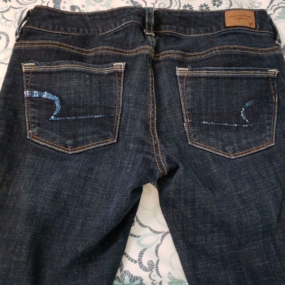 AE LOW RISE BOOT LEG JEANS